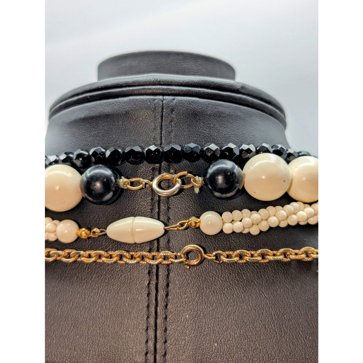 Lot of Ten Cream Black Jewelry Pieces -- Four Necklaces & Six Bracelets
