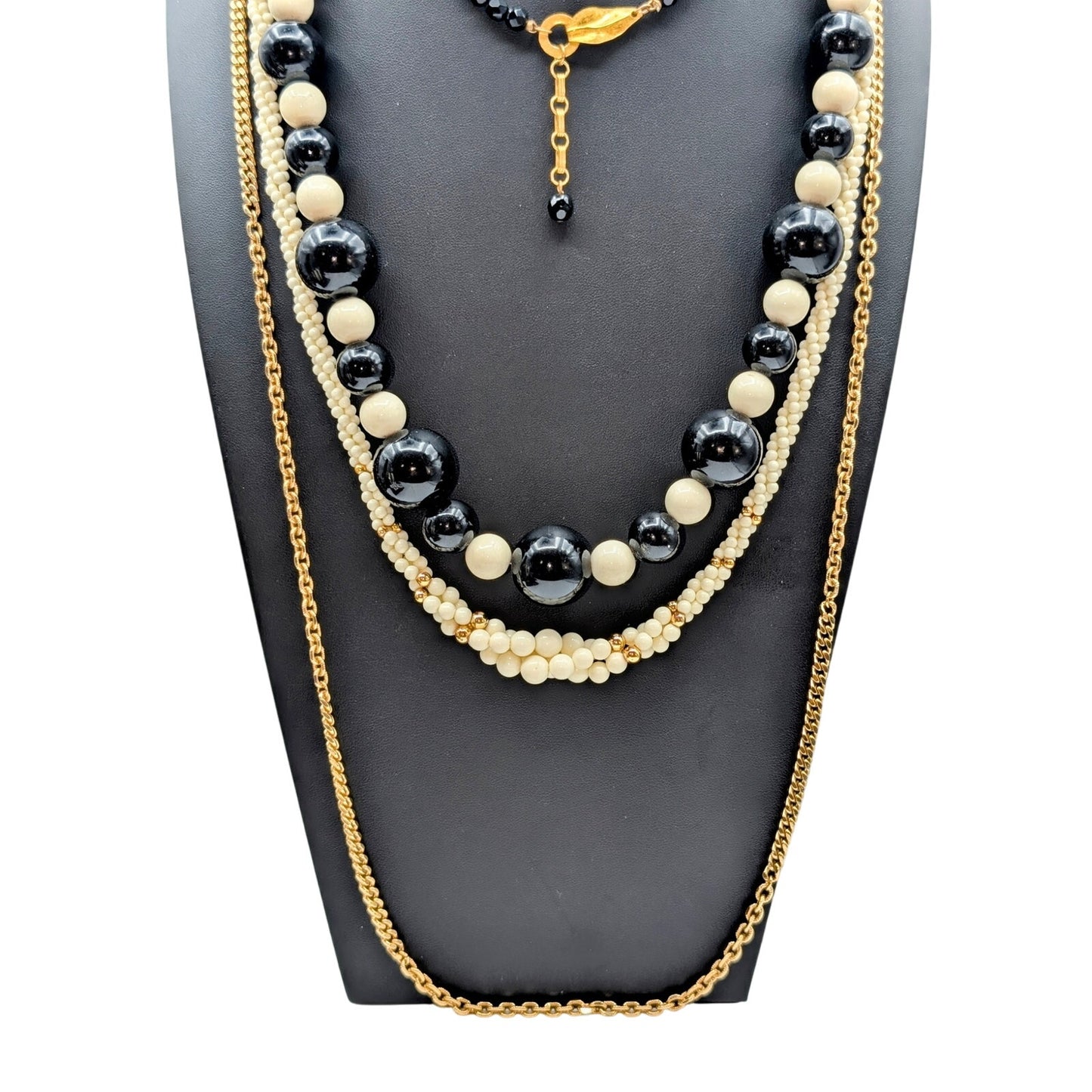 Lot of Ten Cream Black Jewelry Pieces -- Four Necklaces & Six Bracelets