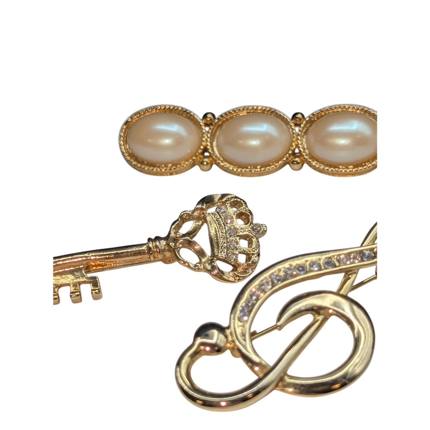 Lot of Four Gold Tone Brooches