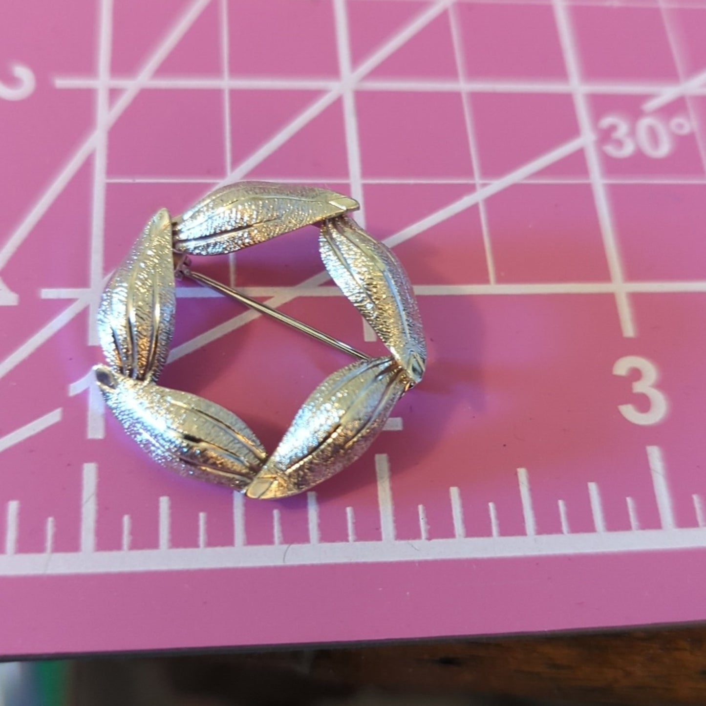 Three Pair of Silver Tone Earrings and One Textured Leaf Wreath Brooch