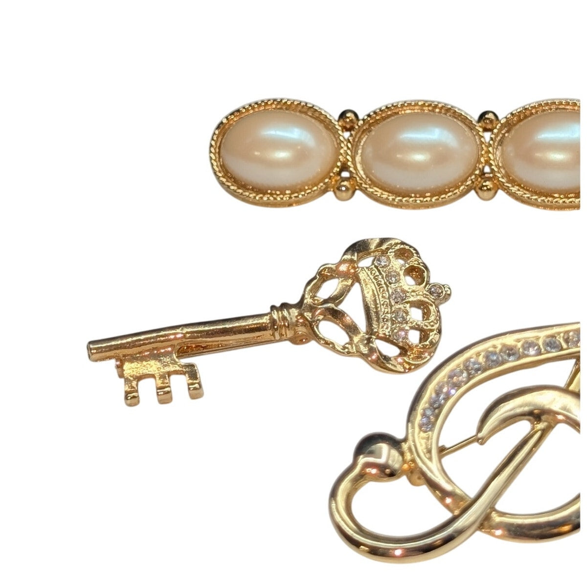 Lot of Four Gold Tone Brooches