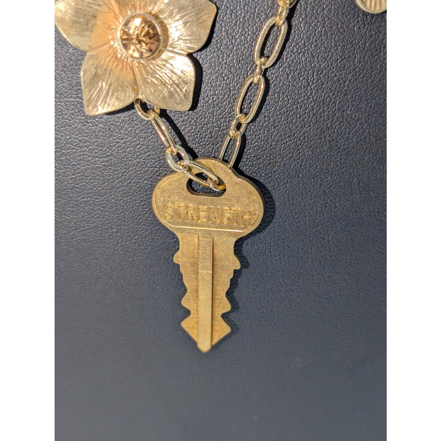 Lot of Two Gold Tone Dangling Flowers & A Giving Key Necklaces