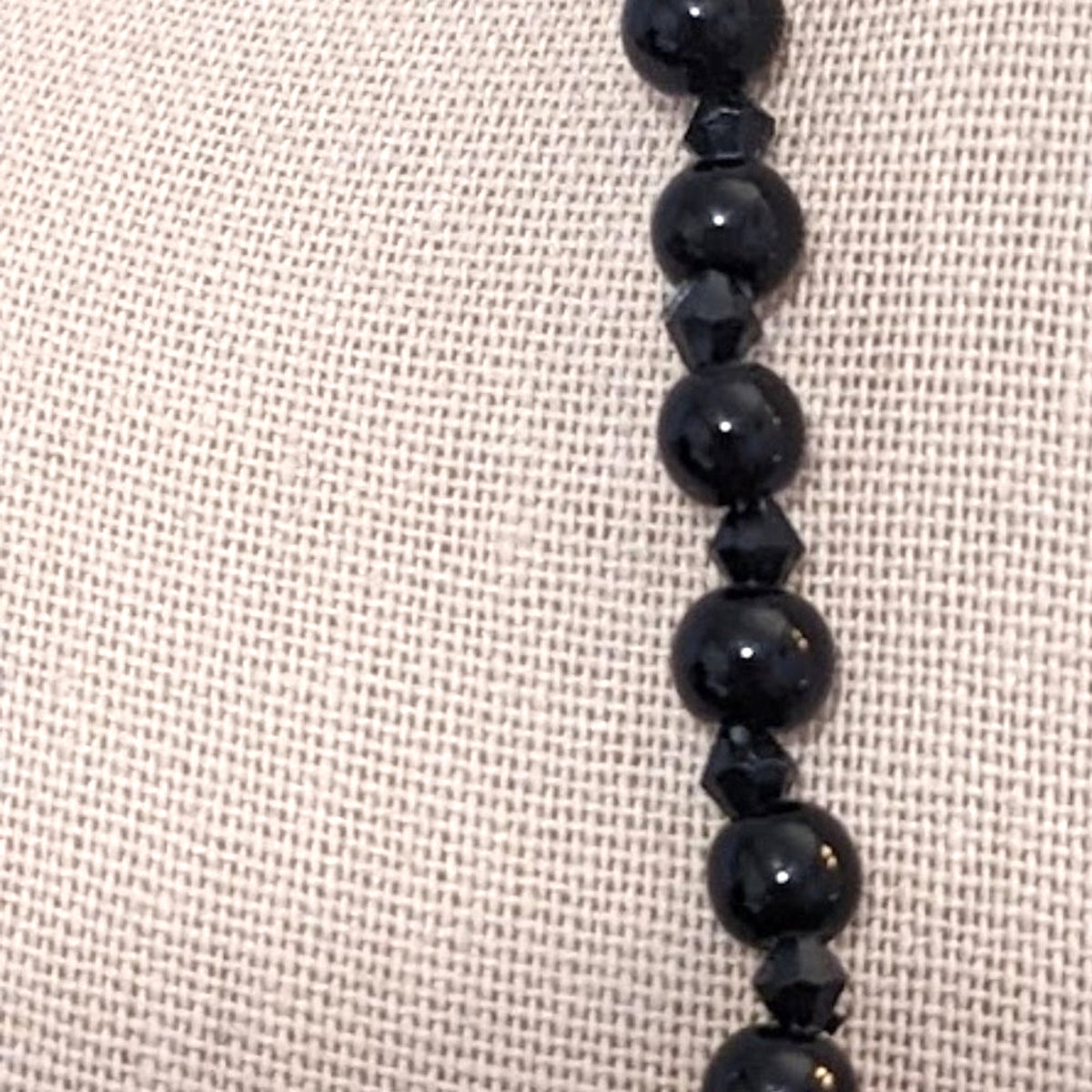 Black bead orange ball tassel necklace
