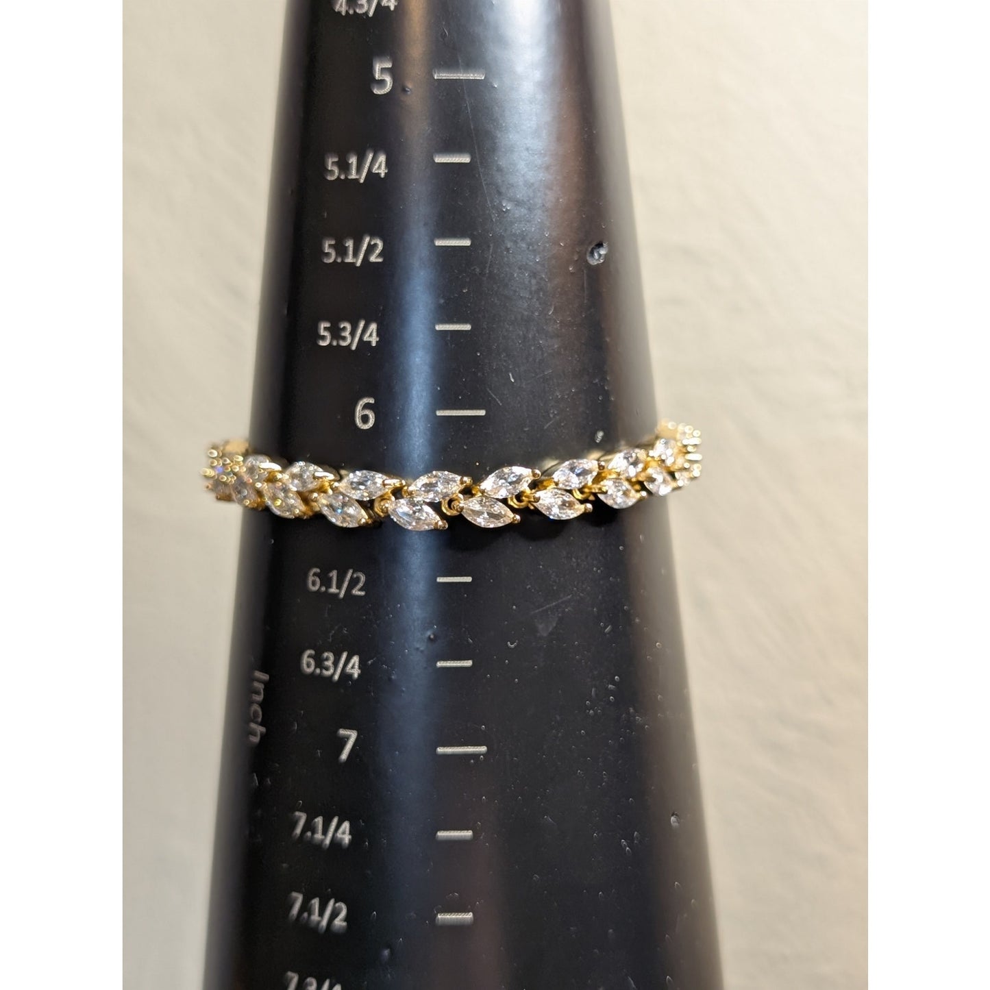 Gold Tone CZ Leaf 7" Long Tennis Bracelet W/ Fold Over Clasp