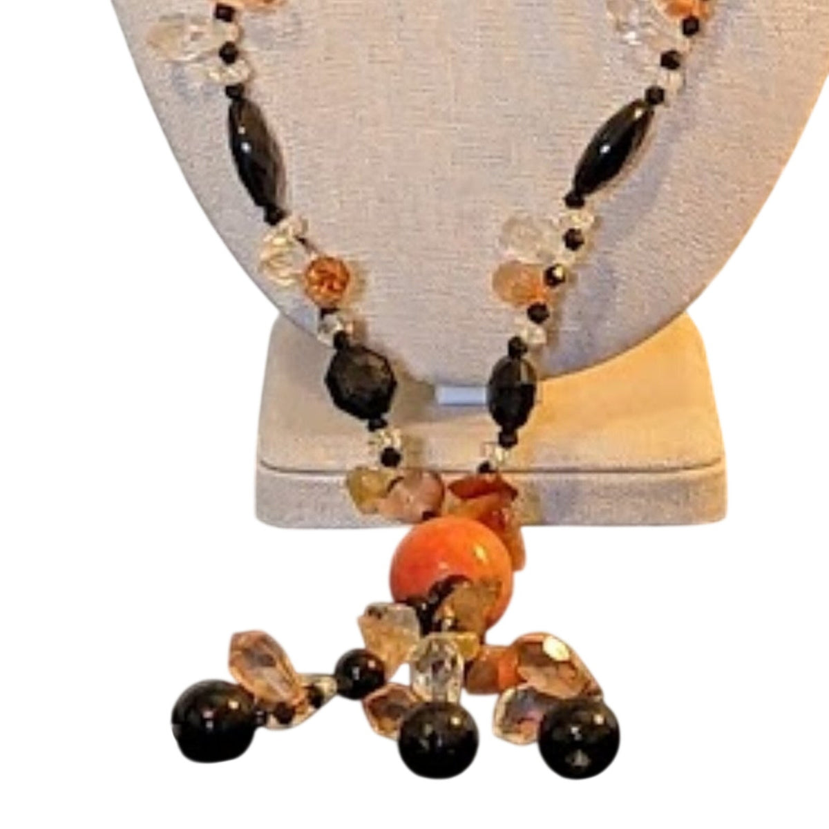 Black bead orange ball tassel necklace