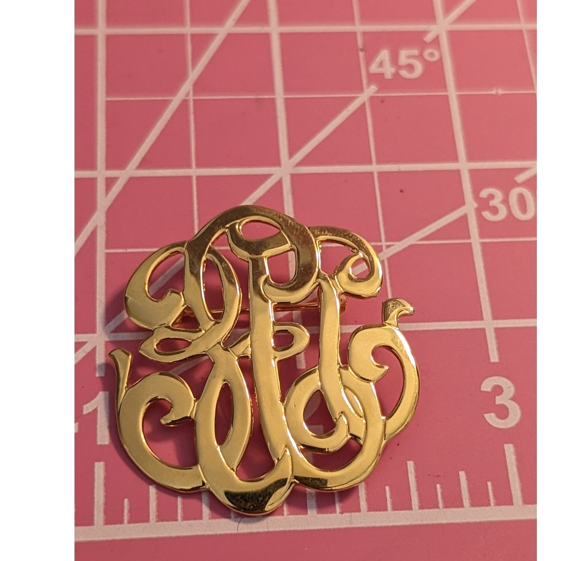 Vintage High Polished Goldtone Swirl Design Brooch