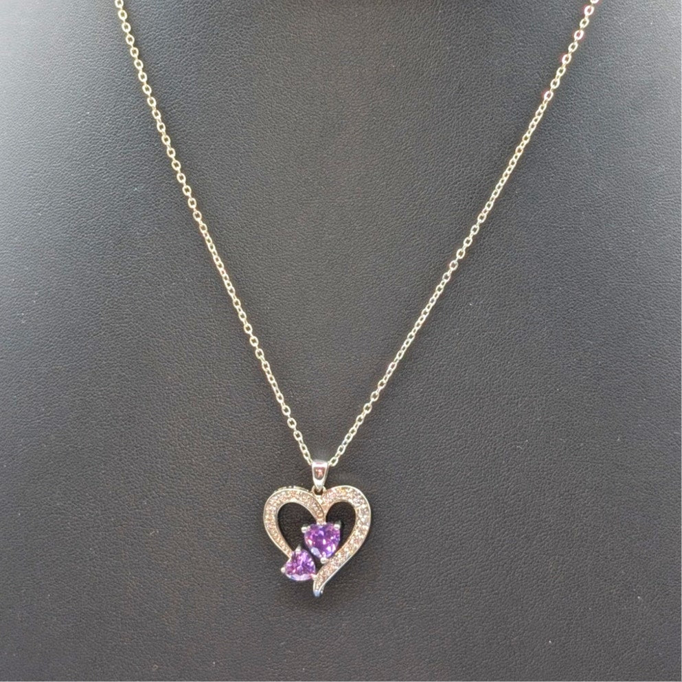 Two Purple Crystal Hearts Within A CZ Studded Heart Silver Tone Pendant Necklace