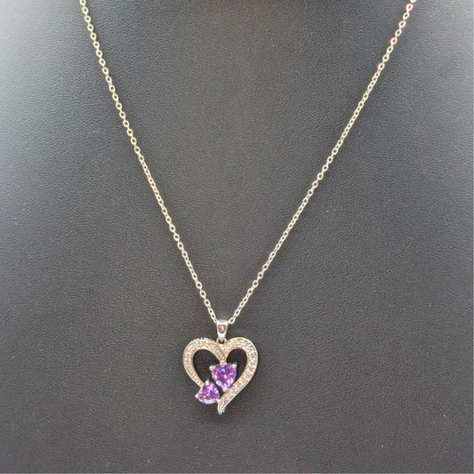 Two Purple Crystal Hearts Within A CZ Studded Heart Silver Tone Pendant Necklace