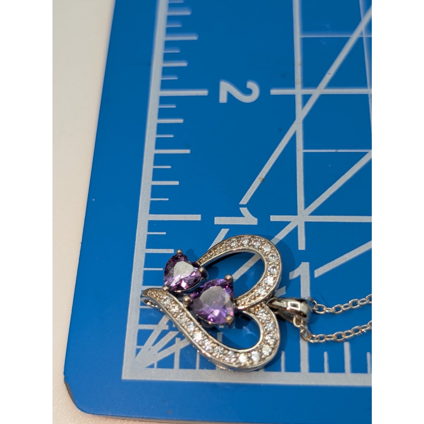 Two Purple Crystal Hearts Within A CZ Studded Heart Silver Tone Pendant Necklace