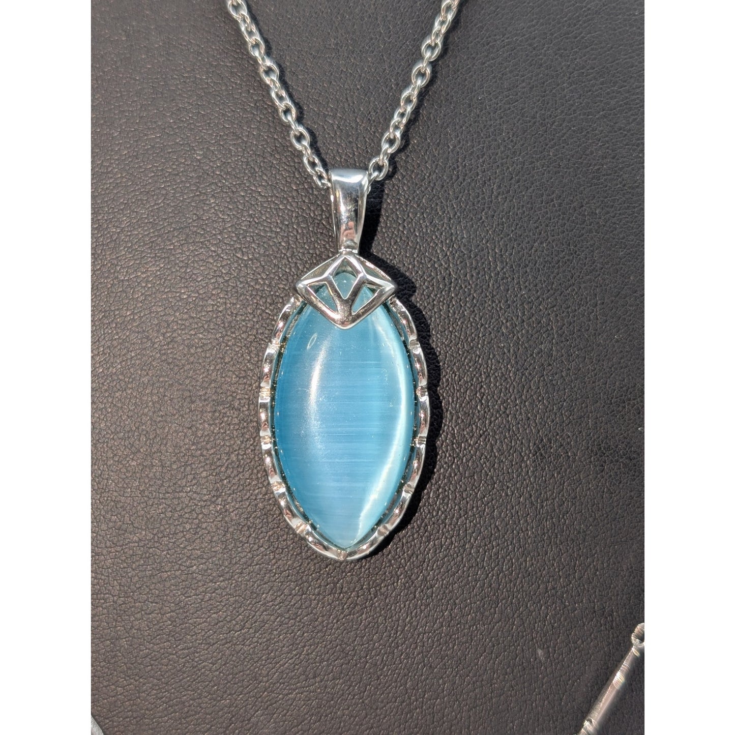 Lot of Three Silver Tone Necklaces-Blue Faux Stone Chain & Avon Vtg Lace Flower