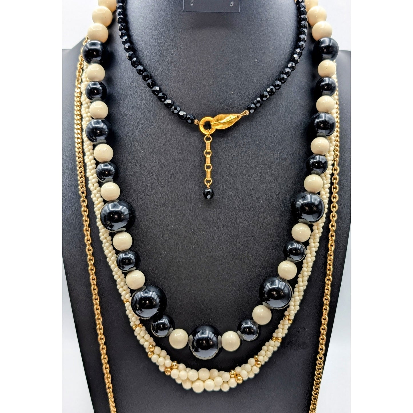 Lot of Ten Cream Black Jewelry Pieces -- Four Necklaces & Six Bracelets