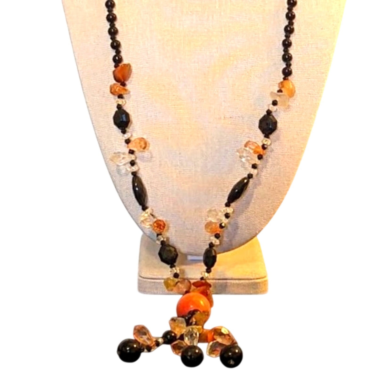 Black bead orange ball tassel necklace