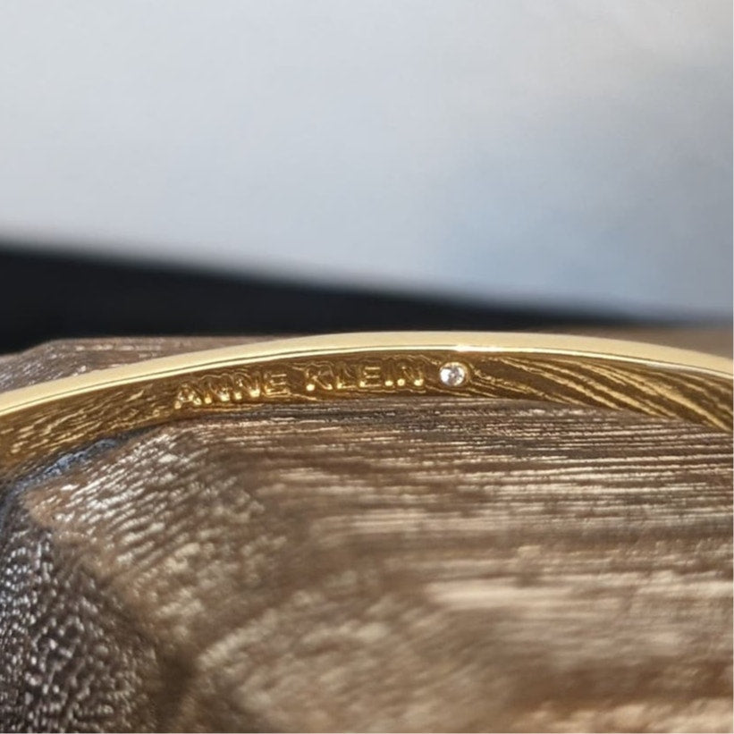 Anne Klein Gold Tone Crystal Floral Oval Bangle Bracelet