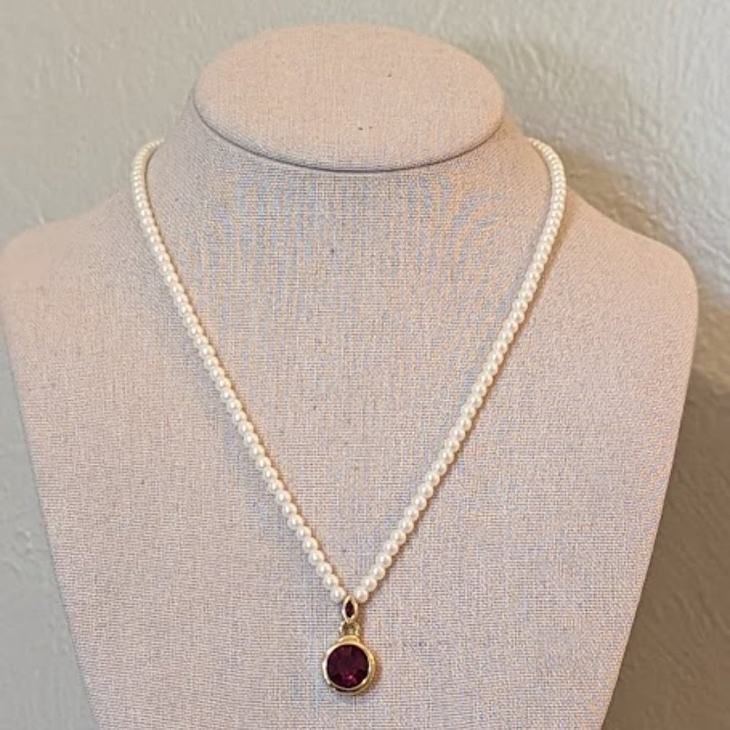 Faux Pearl Necklace with Bezel Set Red Crystal Pendant Set in Gold Tone Metal