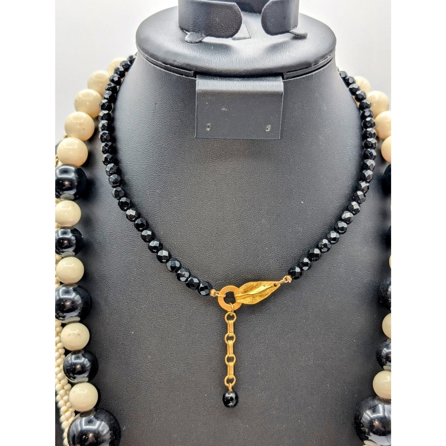 Lot of Ten Cream Black Jewelry Pieces -- Four Necklaces & Six Bracelets