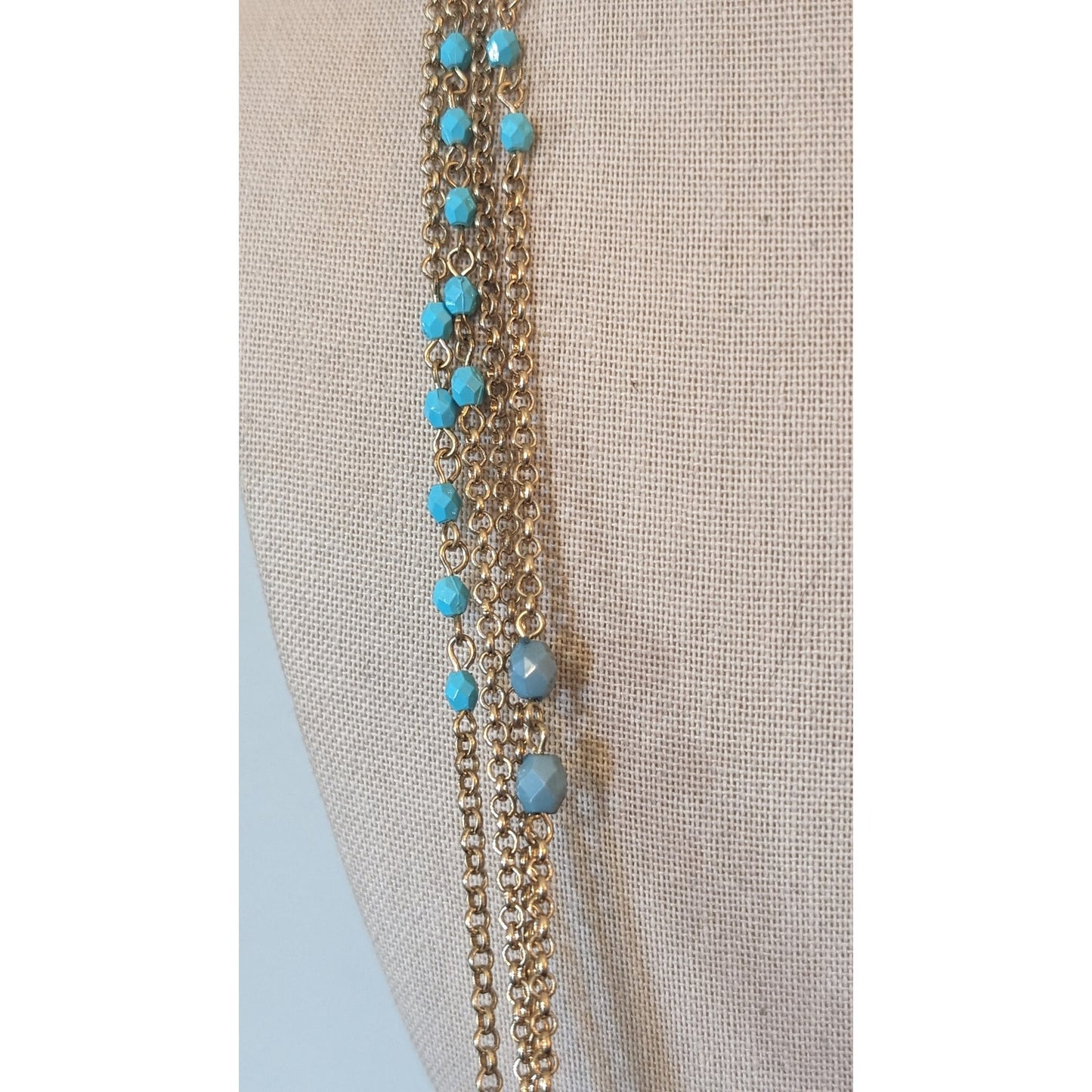 Multi-Strand Gold Tone Chain with Blue Bead Necklace with Braided Cord Closure