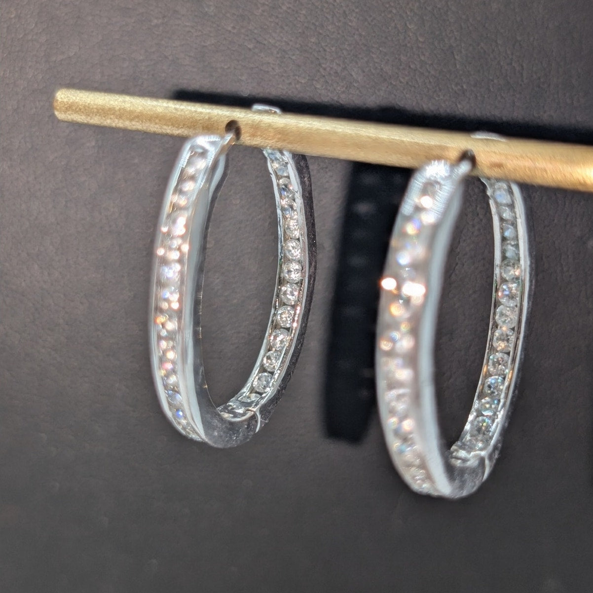 Silver Tone Non Magnetic CZ In and Out Oval Huggie Hoop Earrings