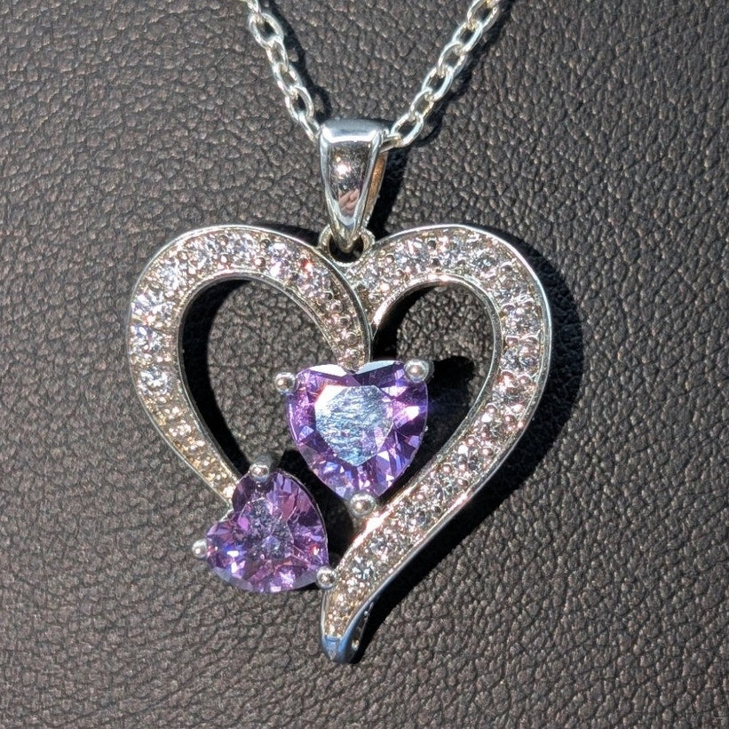 Two Purple Crystal Hearts Within A CZ Studded Heart Silver Tone Pendant Necklace