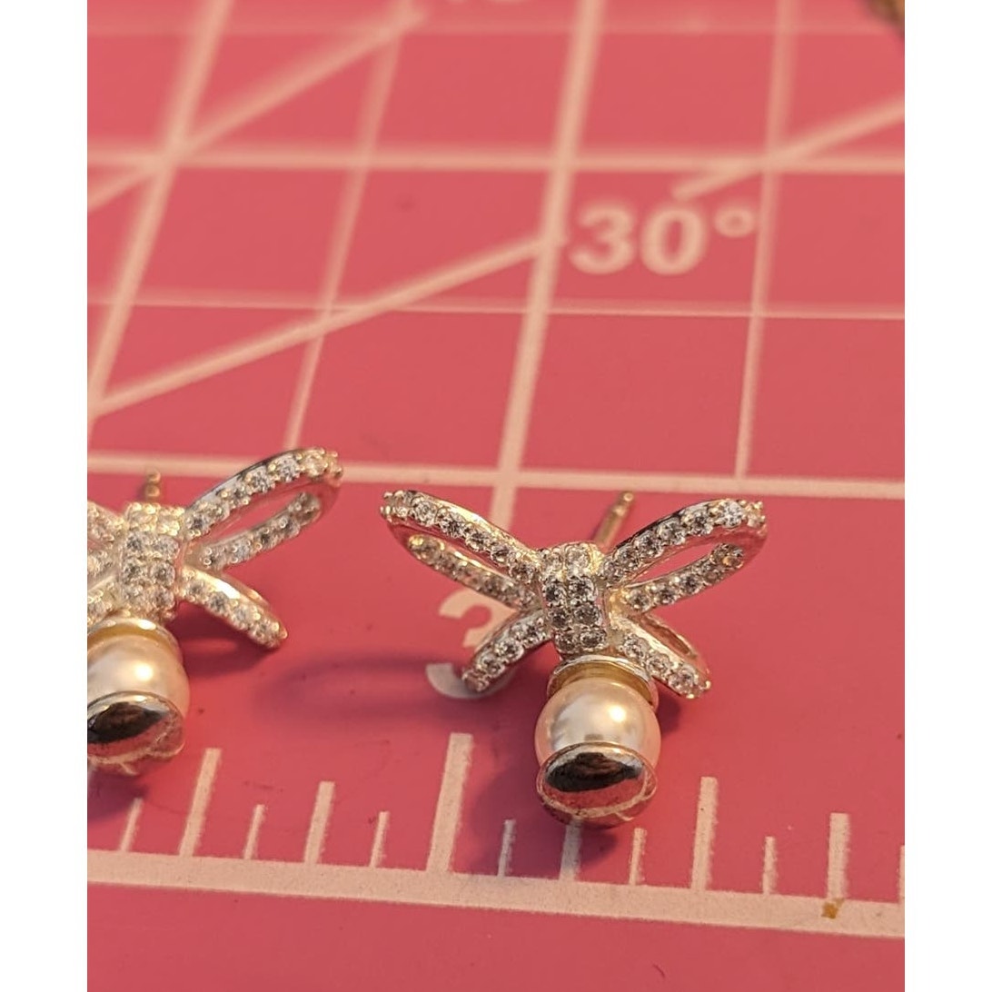 Marked 925 Sterling Silver Dangling Pearls Tied Up W/ A CZ Bow