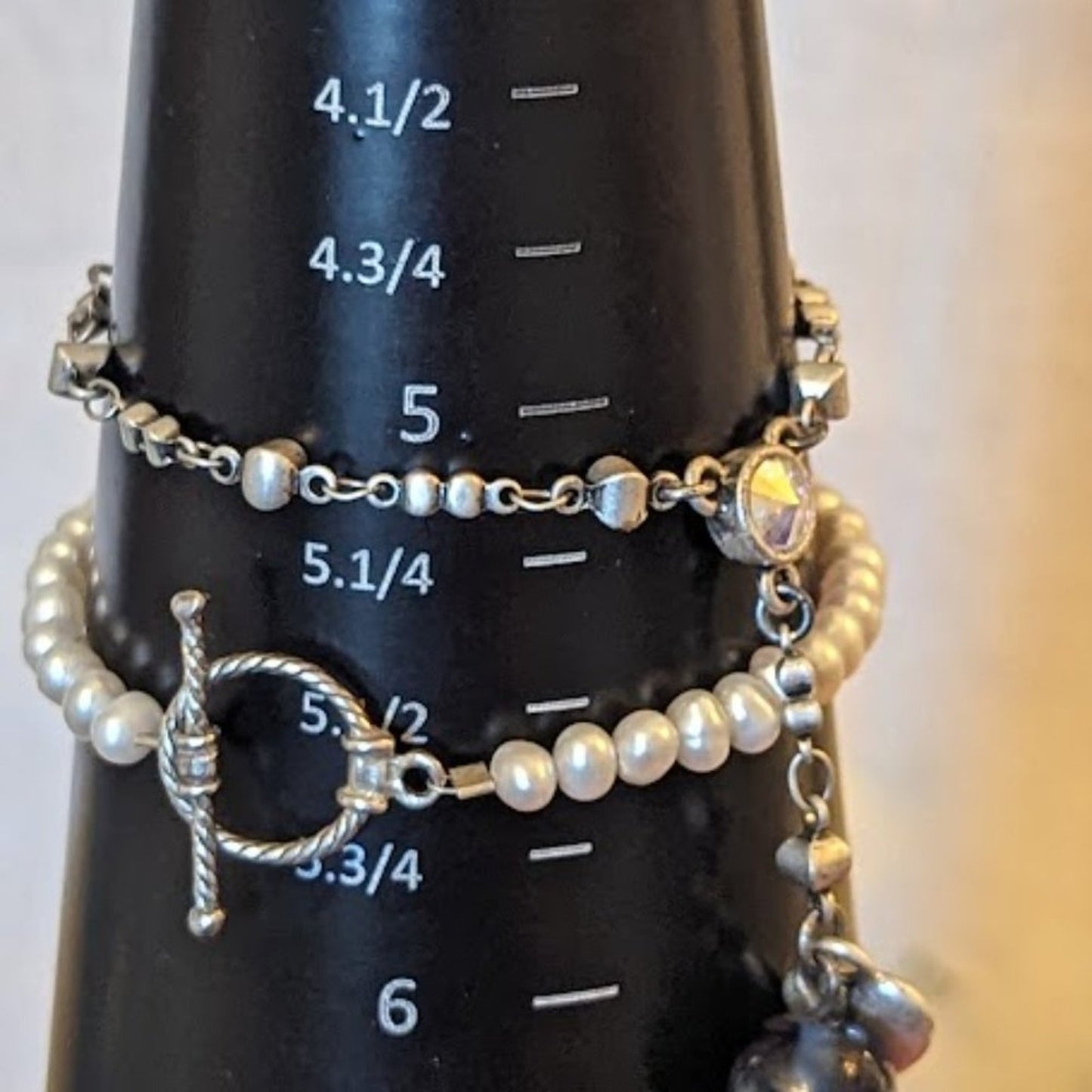 Two Tiny Silver Tone Bracelets