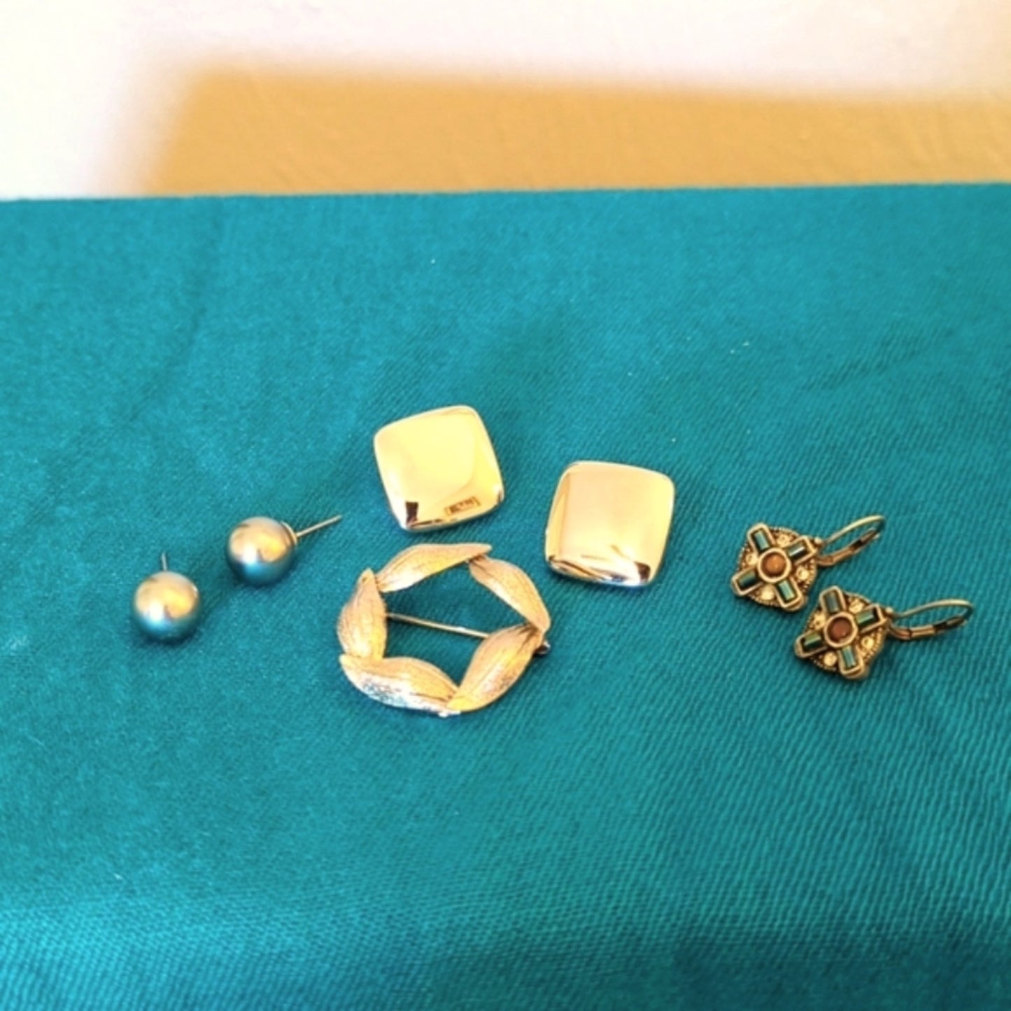Three Pair of Silver Tone Earrings and One Textured Leaf Wreath Brooch