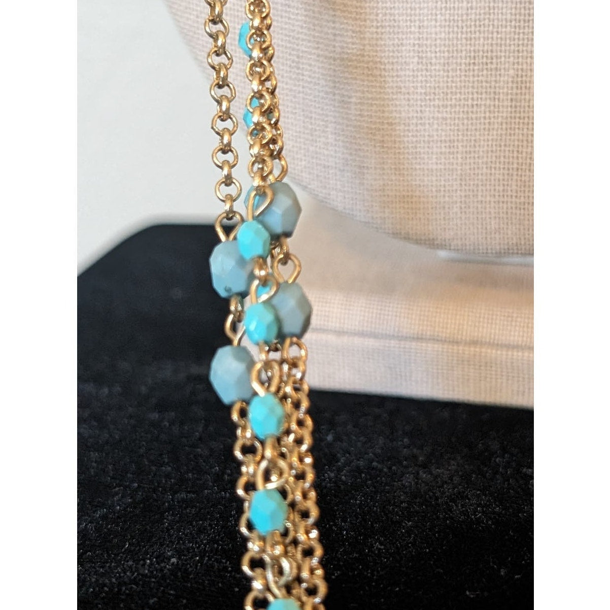 Multi-Strand Gold Tone Chain with Blue Bead Necklace with Braided Cord Closure