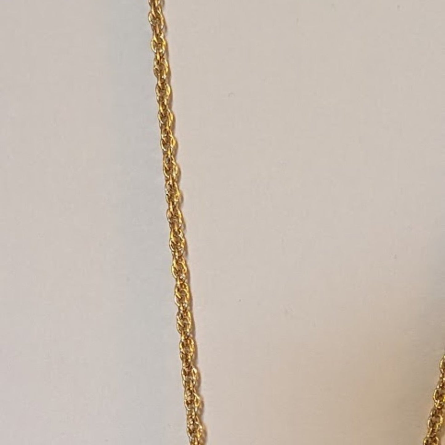 Long Gold Tone Red Reversible Pendant With Tassel