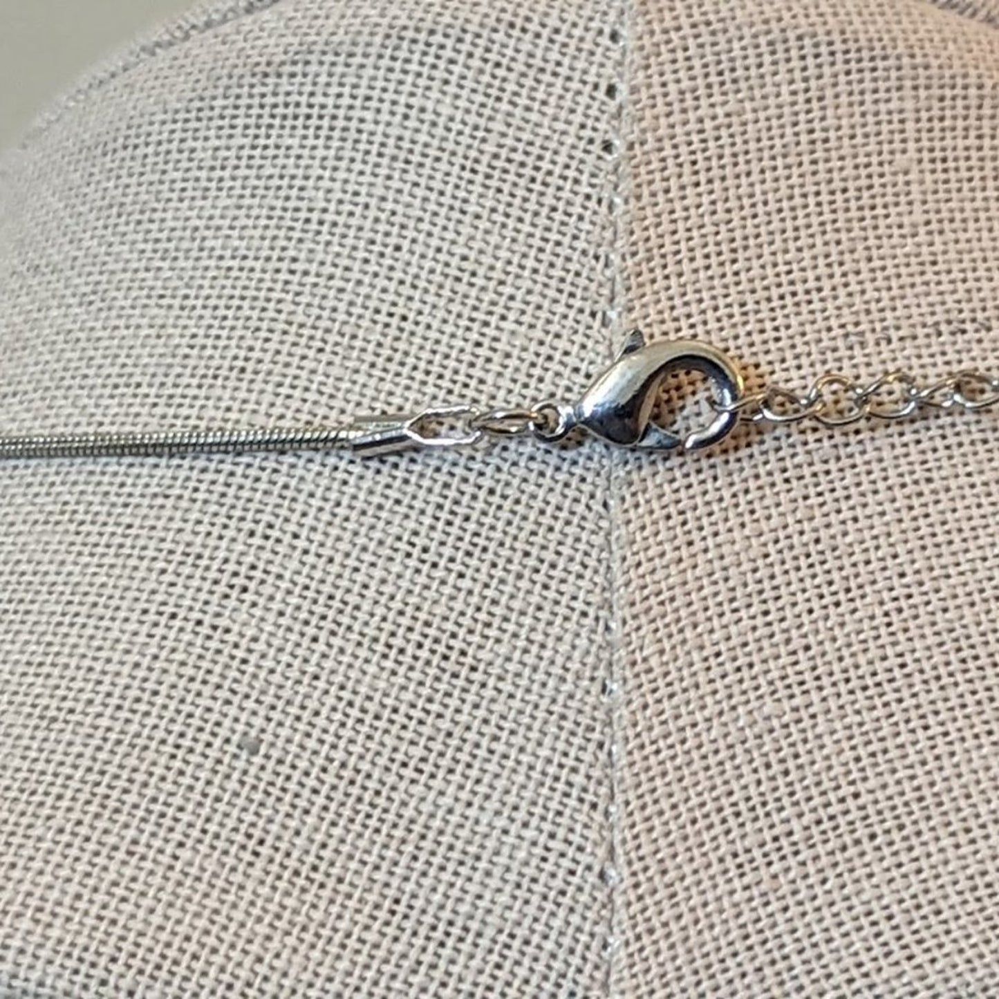 Rhinestone Dog Playing with a Pearl Ball Necklace